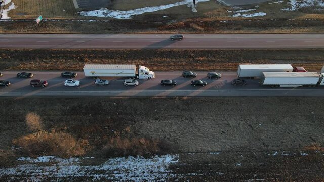 Aerial view of a backup on Interstate 94 just north of Eau Claire, Wisconsin causing semi and cars to drive really slow going westbound Minneapolis