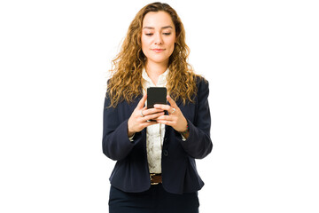 Business woman looking at the screen of her smartphone