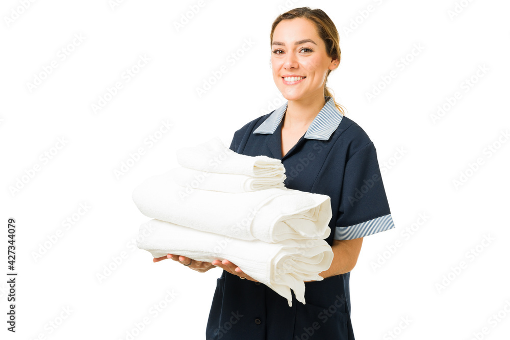 Wall mural Portrait of a cheerful cleaning lady working at a hotel