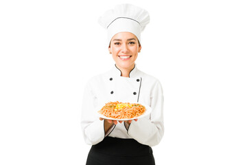 Hispanic chef finishing cooking a delicious dinner