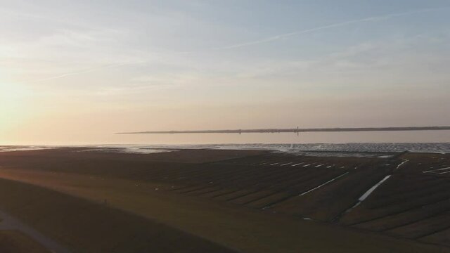 Orange Skies Over North Sea Coast Watt Near Husum Nordfriesland Germany