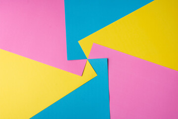 Colored papers in an abstract background 