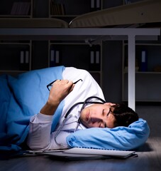 Doctor working night shift in hospital after long hours