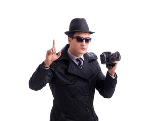 Spy with camera taking pictures isolated on white