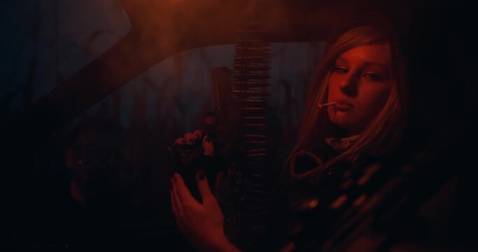 A cool rebellious blonde woman smoking a cigarette and loading her gun in a dark room shot in 4K