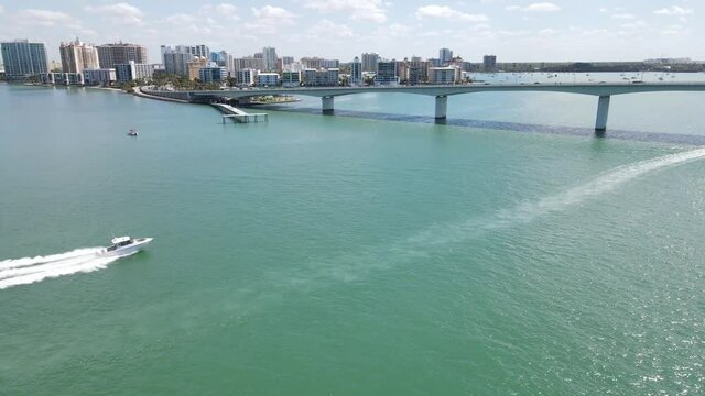 speeding boat under the John Ringling Causeway in Sarasota, Florida