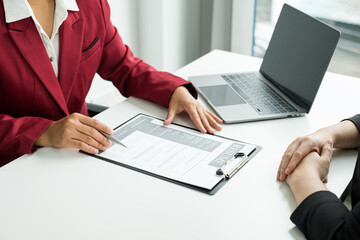 Business people hold a resume and talk to job applicants for job interviews about careers and Their personal history in the company. Recruitment concepts