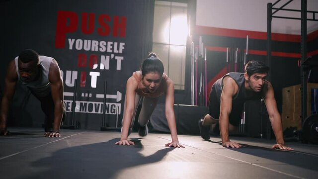Athlete Sporty Group Cardio Exercise Burning Calorie HIIT in Fitness Gym Fit Body Healthy Lifestyle Athlete Muscle Building Strong Endurance in Health Club.