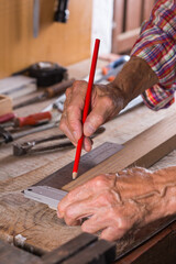 Carpenter working on the work bench, joinery tools and woodwork