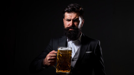 Craft beer. Confident man with glass of beer on black. Degustation and tasting.