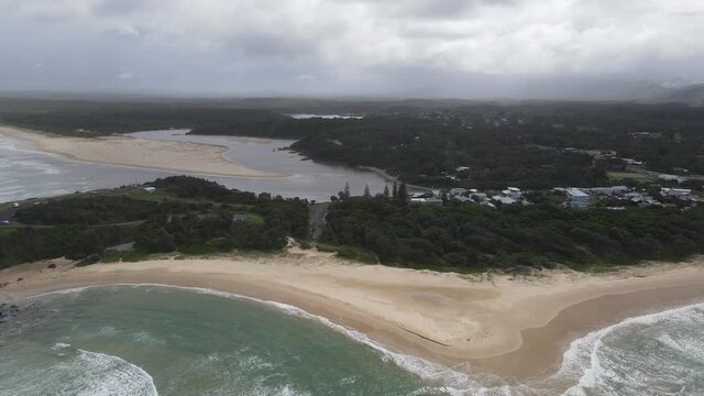 Bonville Headland And Boronia Park With Lush Vegetation In Sawtell, New South Wales. aerial sideways