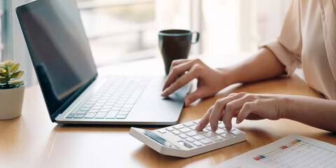 Close up view of bookkeeper or financial inspector hands making report, calculating or checking...
