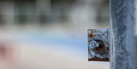 The rusted pole nut in the stadium at the park.selective focus ,closeup shot,with copy space.
