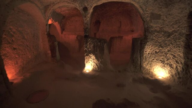 A long corridor connecting the rooms of the underground city.Subterranean defensive refuge place living cellar storage cellars cisterns drainage channel narrow road inside cave excavated old stone age