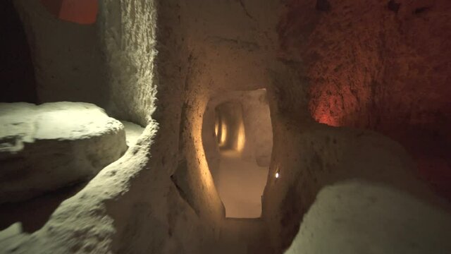 A long corridor connecting the rooms of the underground city.Subterranean defensive refuge place living cellar storage cellars cisterns drainage channel narrow road inside cave excavated old stone age