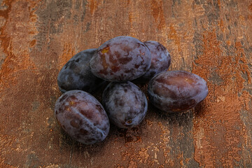 Purple sweet ripe plum heap