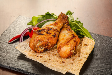 Chicken leg barbecue served salad leaves