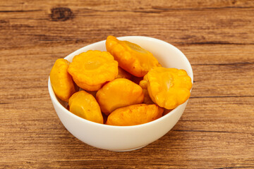 Marinated yellow patisson in the bowl