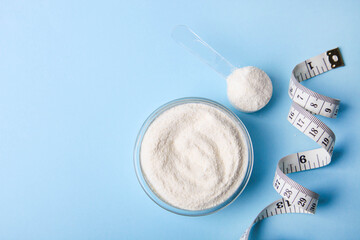 White protein powder and measuring tape