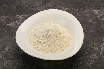 Wheat flour heap in the bowl
