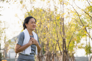 Old Asian people suffer from exercise pain. Senior woman having heart attack