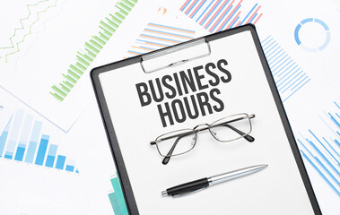 business hours sign. Conceptual background with chart ,papers, pen and glasses