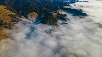 mountains tops high above clouds fog