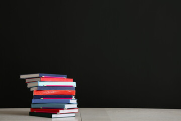 Stack of books on dark background