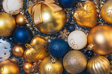 Amazing Christmas composition with gold and blue christmas balls. Christmas or New Year concept. Top view. Winter holidays background. Christmas baubles. 