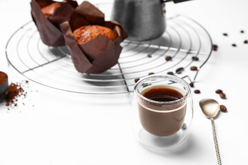 Composition with coffee and muffins on white background