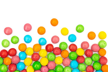 close up of colorful candies on white background with space for text.