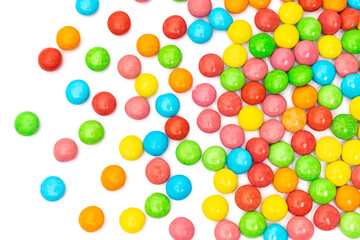 close up of colorful candies on white background