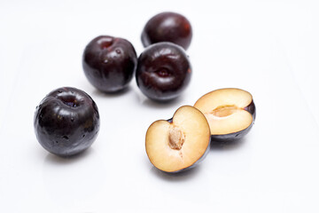 ripe plum on white background