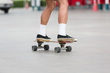 Young people playing skateboarding outdoor. Sports Concept