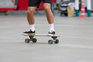Young people playing skateboarding outdoor. Sports Concept