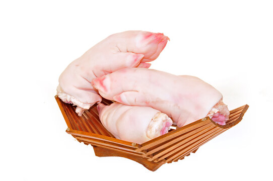 Fresh pig's feet on the white background