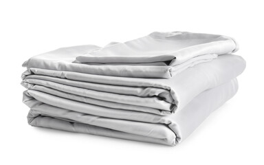 Stack of clean silky bed linen isolated on white