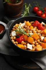Delicious fresh chickpea salad on black table