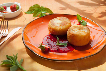 ruddy cheesecakes for breakfast with strawberries.
curd pancakes. Traditional Russian and Ukrainian breakfast.