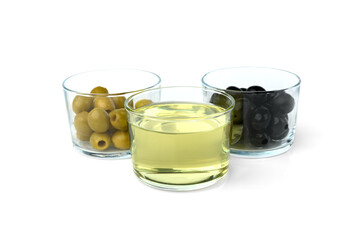 Green and black olives and olive oil isolated on white background.