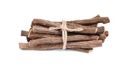 Dried sticks of liquorice root on white background