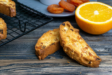 Biscotti with orange filling on a dark table