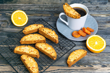 Biscotti with orange filling on a dark table