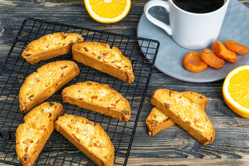 Biscotti with orange filling on a dark table