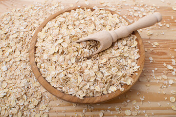 Tasty oatmeal on wooden table