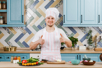 The chef presents something in the kitchen.