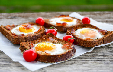 Fried egg on Wholegrain low carb  Toast with cherry tomatoes. Ketogenic  diet healty  food.Traditional French Dish Croque-Madame 