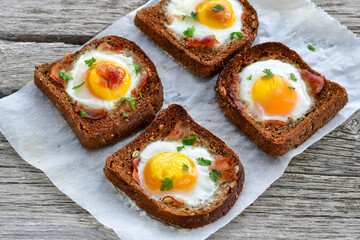 Fried egg on Wholegrain low carb  Toast with cherry tomatoes. Ketogenic  diet healty  food.Traditional French Dish Croque-Madame