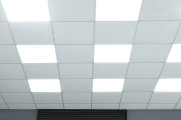White ceiling with lighting in office room