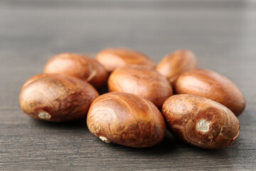 Many raw jackfruit seeds on wooden table, closeup